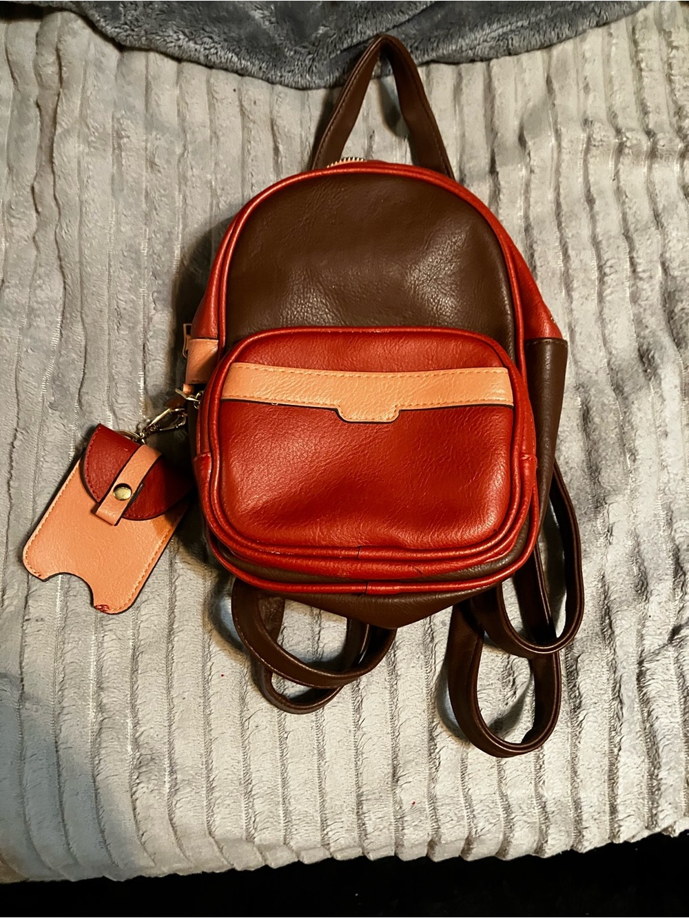 Compact Brown and Red Leather Backpack with Tan Accent